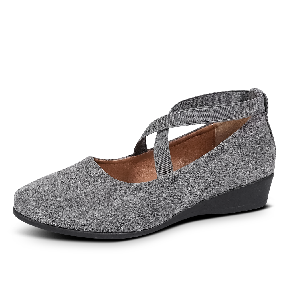 Gray wedge shoe with a strap on a white background