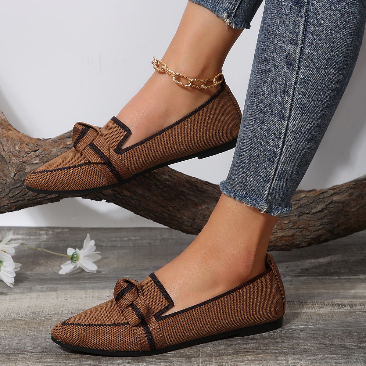 Woman wearing Florentine brown pointed knit flats side view