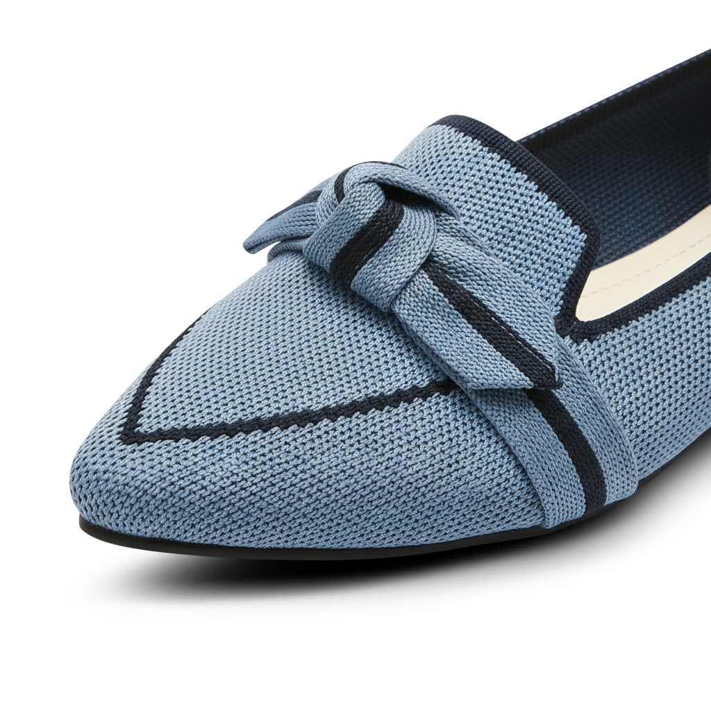 Blue loafer shoe with a knot detail on a white background