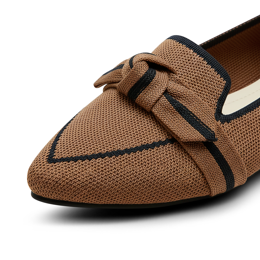 Brown loafer shoe with a knot detail on a white background