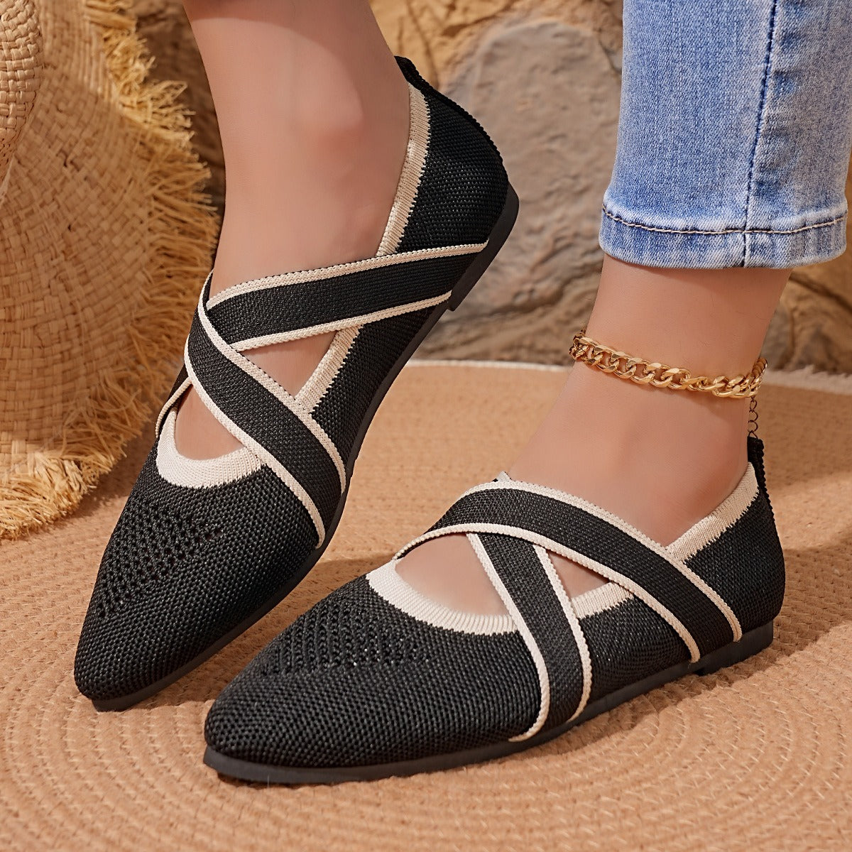 Woman wearing black Siena Point Flats with crossover elastic straps